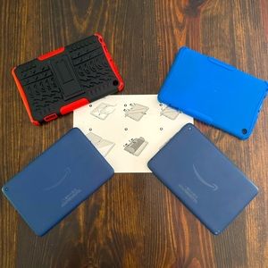 Two like new Amazon Fire 7 tablet with cases and never used screen protectors